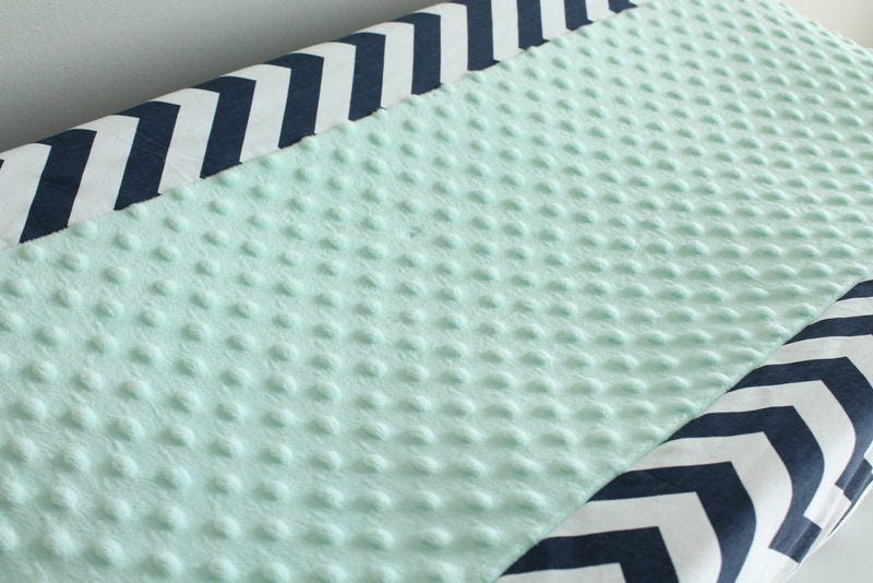 In Stock. Nursery Contour cover navy chevron with mint minky