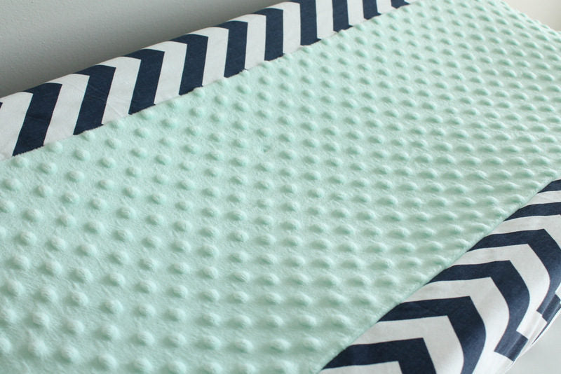In Stock. Nursery Contour cover navy chevron with mint minky