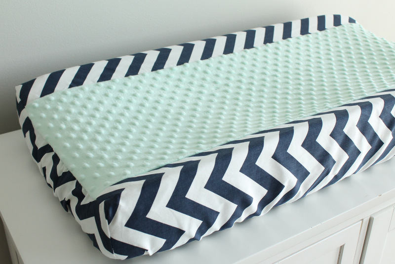 In Stock. Nursery Contour cover navy chevron with mint minky