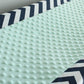 In Stock. Nursery Contour cover navy chevron with mint minky